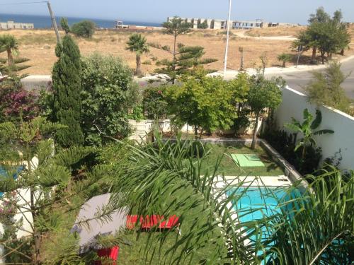 an aerial view of a garden with a swimming pool at Villa 33 haut standing Avec piscine et Hammam in Tangier