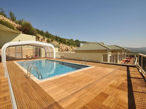 a swimming pool on top of a house at White Suites in Majdal Shams