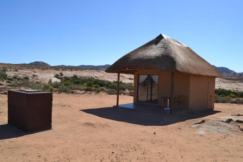 a small hut in the middle of the desert at Sperrgebiet Lodge in Springbok
