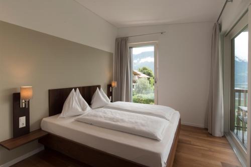 Postel nebo postele na pokoji v ubytování Apparthotel Calma