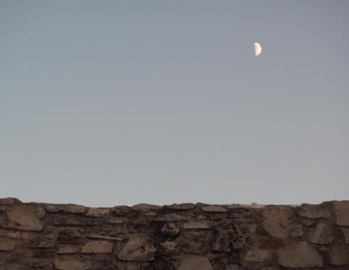 a brick wall with a white sky in the background at Trinity Boutique Hotel in Rhodes Town