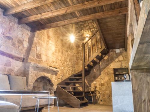 a staircase in a room with a stone wall at Trinity Boutique Hotel in Rhodes Town