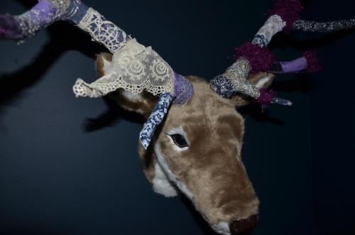 a stuffed animal with horns on its head at Chambres d'Hôtes & SPA Le Chat Chez Qui j'Habite in Saint-Aubin-sur-Mer