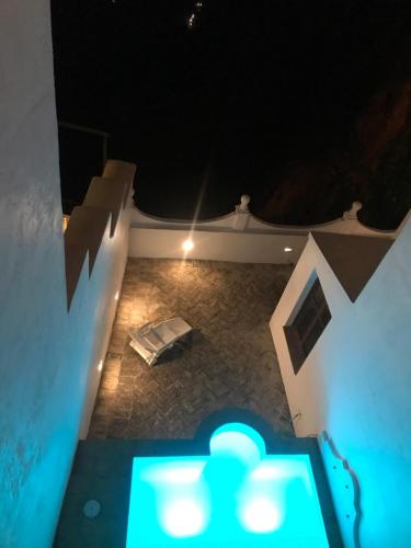 an overhead view of a pool at night at Casa Palacio VillaZambra in Ronda
