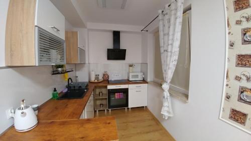 Η κουζίνα ή μικρή κουζίνα στο Polhouse Apartamenty