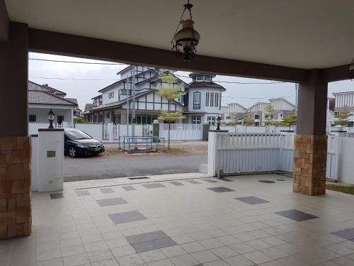 an open patio with a car parked in a parking lot at Sitiawan Homestay Entire Semi D house in Sitiawan