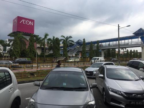 a bunch of cars parked in a parking lot at Ophir Inn in Skudai