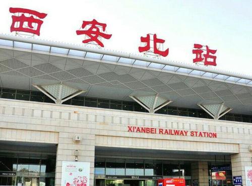 a building with chinese writing on the top of it at One Meter Sunshine Xi'an Xianyang International Airport Hotel in Xianyang