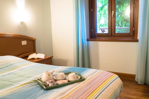 Postel nebo postele na pokoji v ubytování Agriturismo Fogolar da Capo