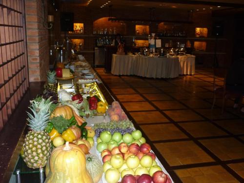 a buffet of fruits and vegetables on display in a restaurant at Promenade Hotel in Beirut