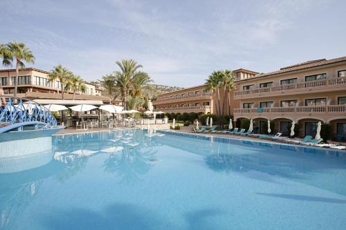 a large swimming pool in front of a building at Mon Port Hotel & Spa in Port d’Andratx