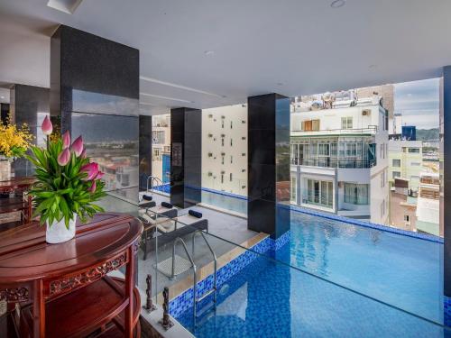 a view of a swimming pool on a building at Red Sun Nha Trang Hotel in Nha Trang