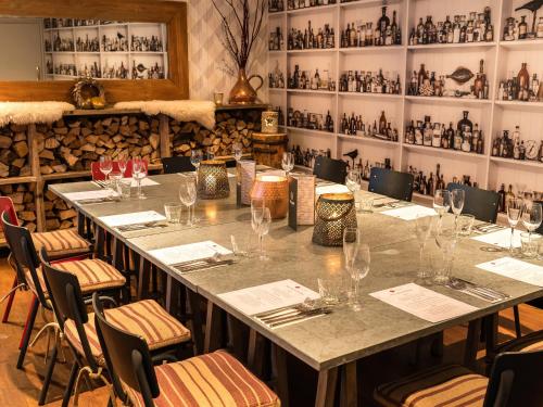 a long table in a restaurant with wine glasses at The Rose and Crown in Warwick