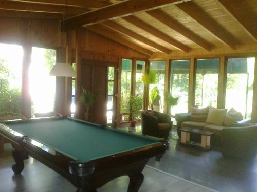 a living room with a pool table in a house at Claudia in Eforie Sud