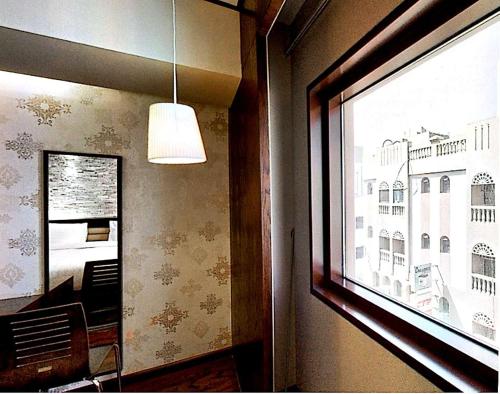 a window in a room with a view of a building at Mark Inn Hotel Deira in Dubai