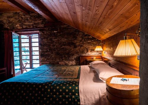 Postel nebo postele na pokoji v ubytování Albergo Montagna Di Luce