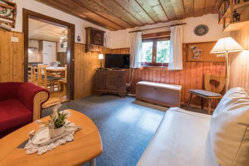 a living room with a couch and a table at Almliesl LUNG-495 in Annaberg im Lammertal