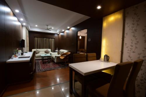 a living room with a couch and a table at Hotel Daspalla in Visakhapatnam