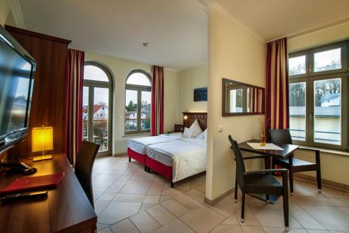 Ένα ή περισσότερα κρεβάτια σε δωμάτιο στο Waldhotel