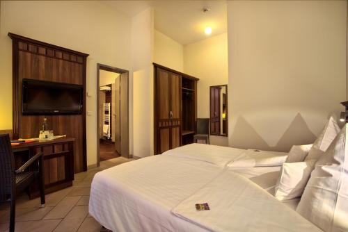 Ένα ή περισσότερα κρεβάτια σε δωμάτιο στο Waldhotel