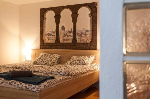 Postel nebo postele na pokoji v ubytování Feel at home Apartment