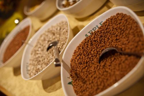 three bowls of lentils sitting on a table at Residence Fallrohrhof in Naturno