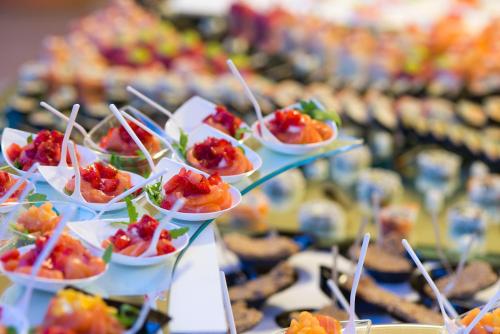 a bunch of appetizers in small dishes on a table at Hotel Villa Durrueli Resort & Spa in Ischia