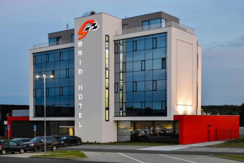 a large building with acedes benz sign on it at Grid Hotel in Brno