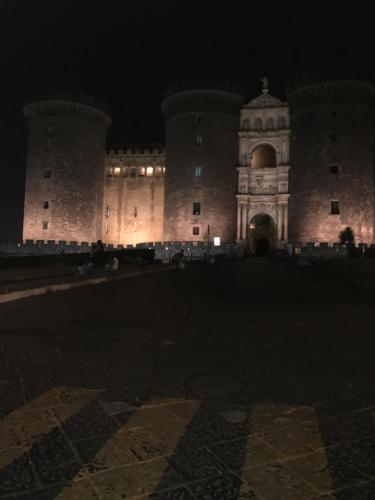 a castle at night with its lights on at L'Approdo di Dante in Naples