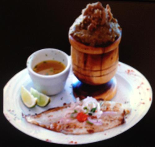 a plate of food with a dessert and a cup of soup at Hotel Caribe in Santa Cruz de Barahona