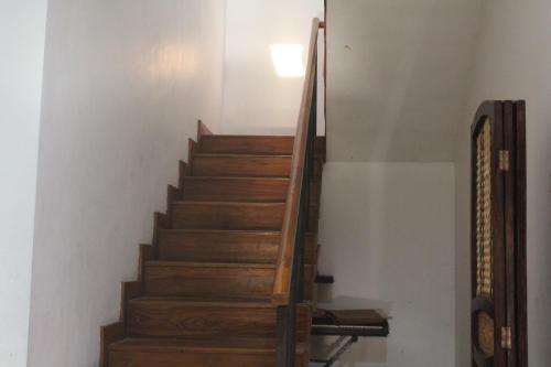 a staircase with wooden steps in a room at Rabbani Family Homestay in Yogyakarta
