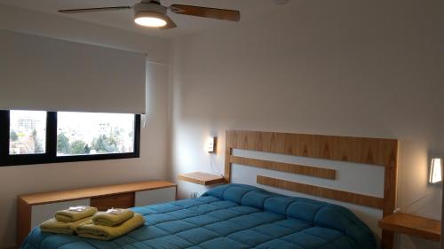 Ένα ή περισσότερα κρεβάτια σε δωμάτιο στο Tu Hogar en Neuquen