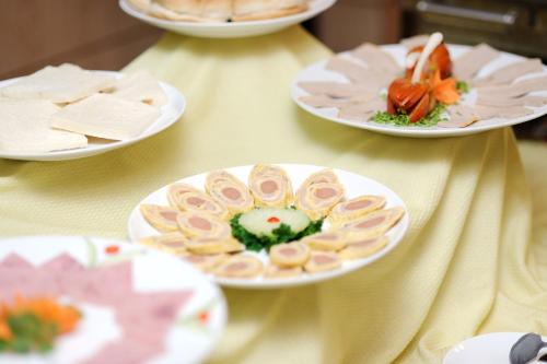 a table with plates of food on top of it at Hoang Yen Hotel in Thuan An
