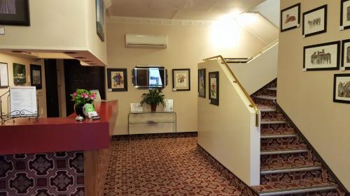 a hallway with a staircase in a building at Foveaux Hotel in Bluff