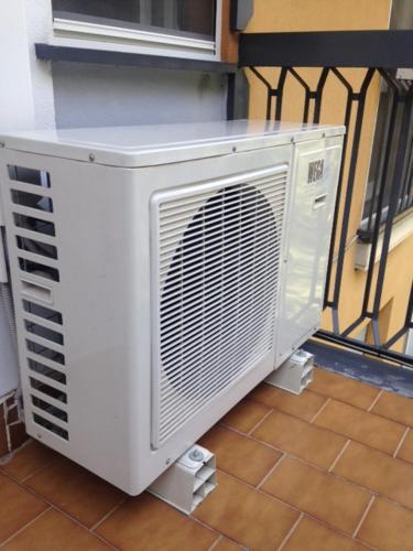 a white air conditioner is sitting on a floor at Appartamento del Golf - Secured Parking - in Rapallo