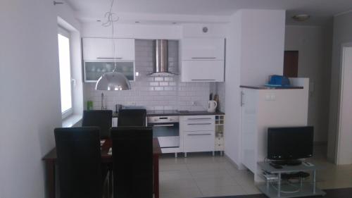 Kuchyň nebo kuchyňský kout v ubytování Apartament Nadmorski Jelitkowo