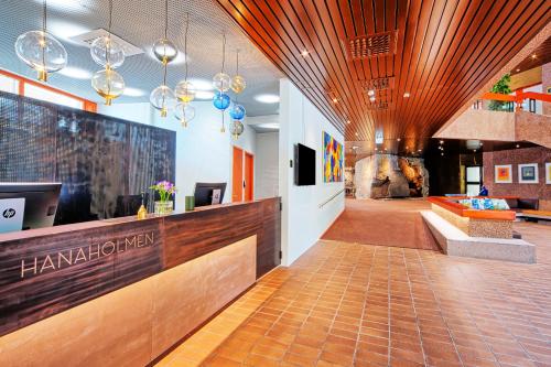 a lobby of a hotel with a reception desk at Hotel Hanasaari in Espoo