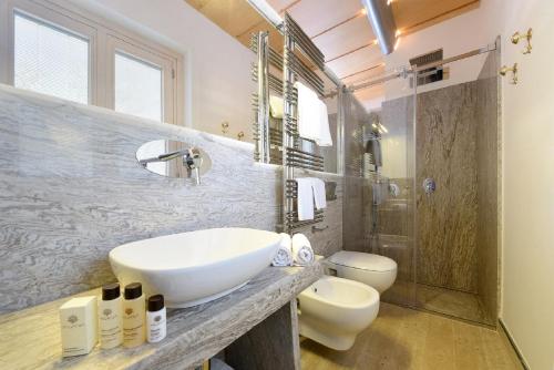 a bathroom with a sink and a toilet at Don Antonino Relais in Sorrento