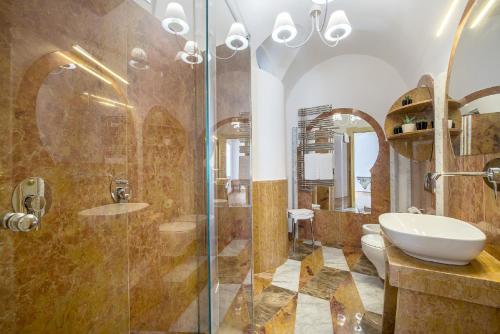 a bathroom with a shower and a sink and a toilet at Don Antonino Relais in Sorrento