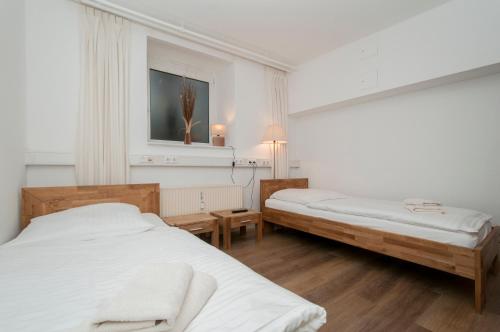 En eller flere senge i et værelse på Appartements in der historischen Deichstrasse contactless Check in
