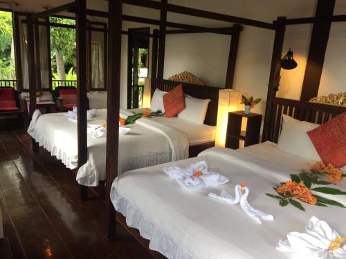 En eller flere senger på et rom på Khoum Xieng Thong Boutique Villa