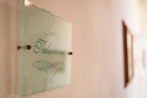 a sign on a wall that says valhalla at Dimora Palazzo La Fenice in Massa Marittima
