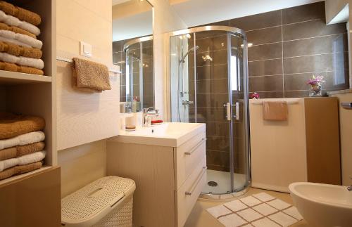 a bathroom with a shower and a sink at Apartment Porpo in Malinska