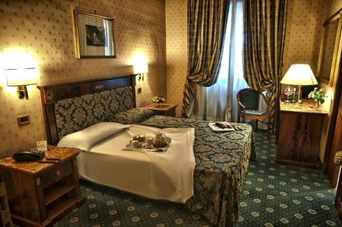 Postel nebo postele na pokoji v ubytování Hotel Cilicia