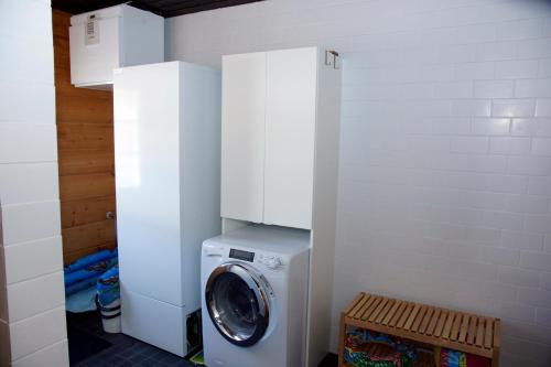 a washer and dryer in a laundry room at Villa Kuukkeli in Salla