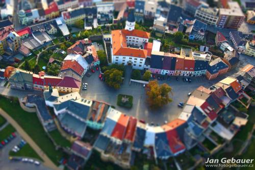 a model of a city with buildings and a street at Hotel FIT in Přerov