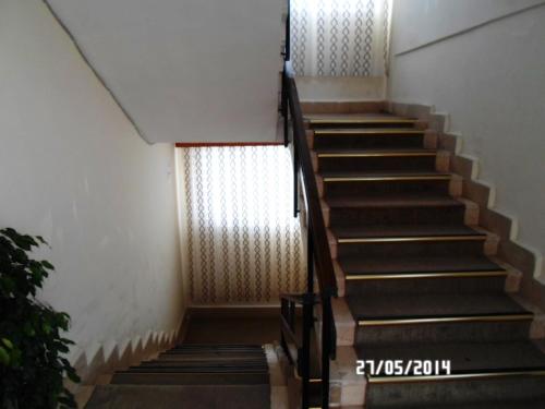 a set of stairs in a building with a window at Hasyurt Hotel in Finike