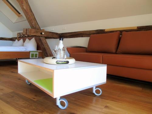 a living room with a coffee table and a couch at Brauhaus 3 - Adults only in Königsberg in Bayern