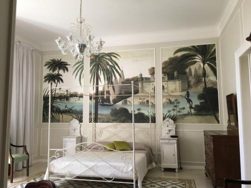 a bedroom with a bed and a painting on the wall at Villa Verganti Veronesi in Inveruno