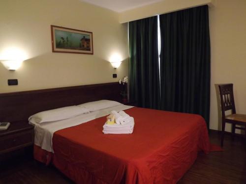 מיטה או מיטות בחדר ב-Hotel Kristall